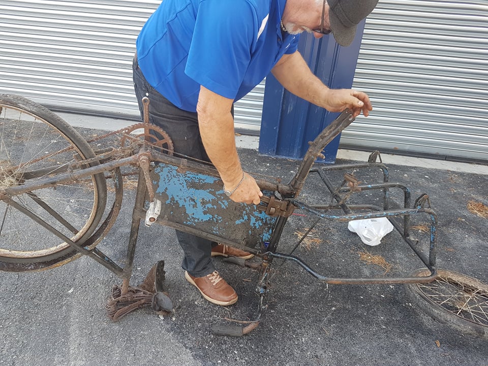 Brian taking the bike apart. 