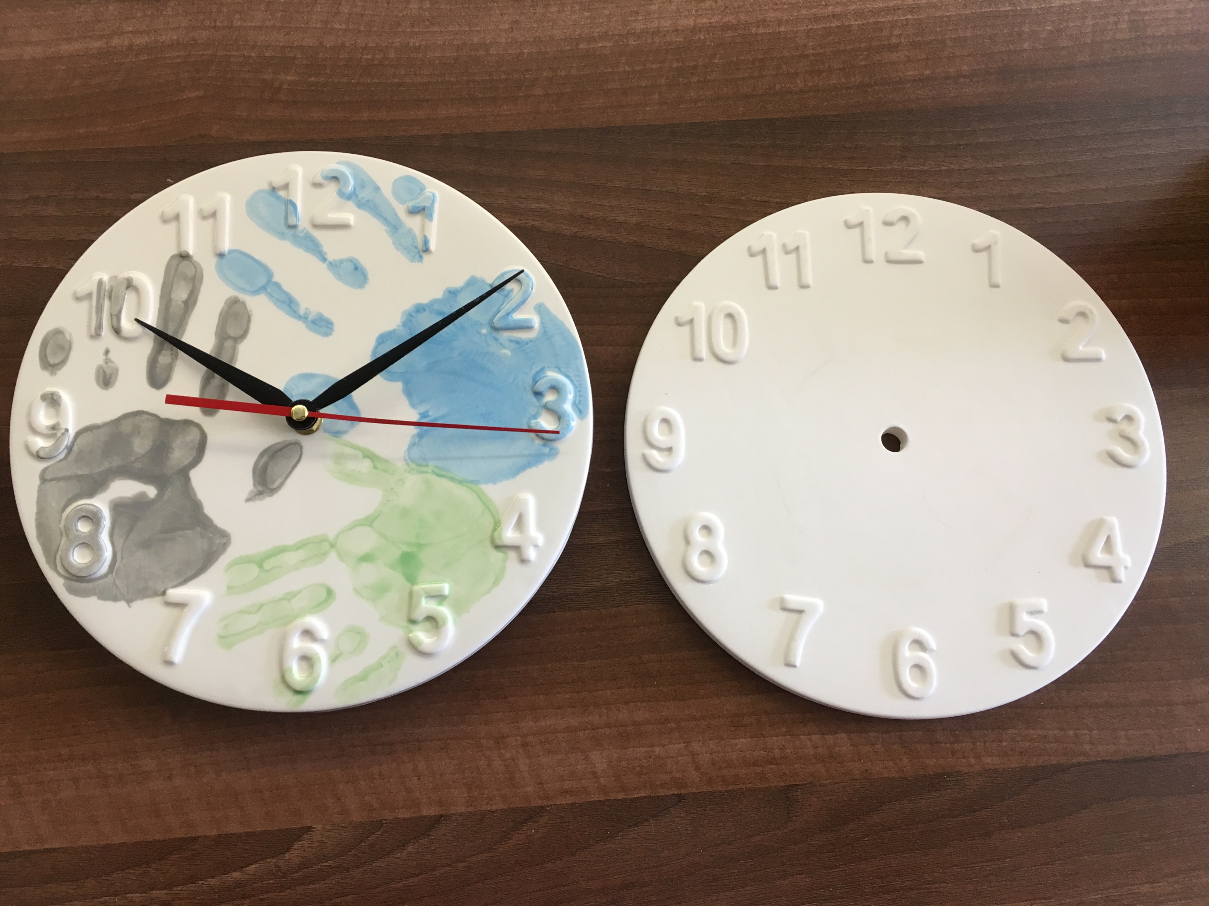Hand prints on a ceramic clock